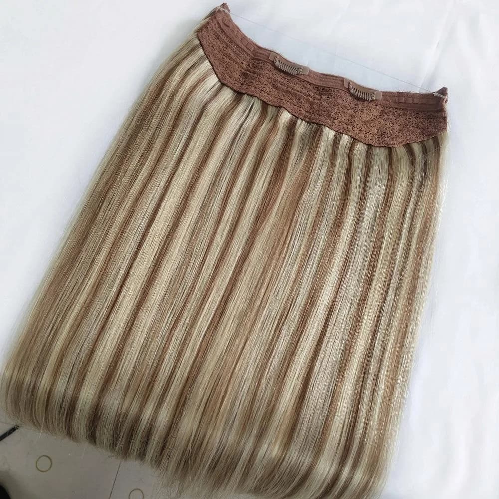 Highlighted blonde Halo Hair piece showing the base and comb clips
